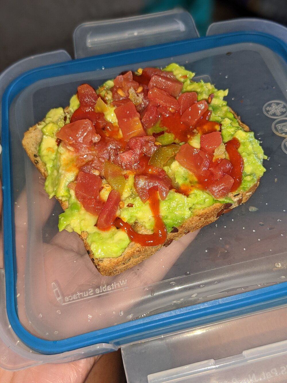 Avocado toast topped with diced tomatoes 
