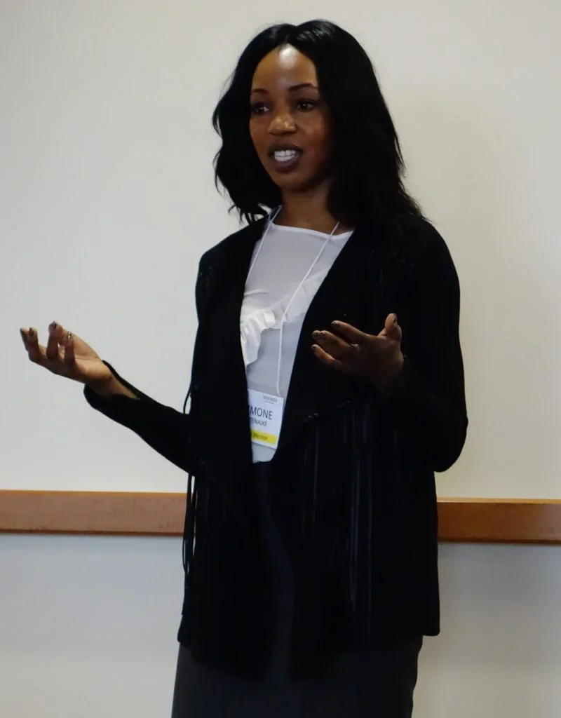 Simone Otenaike leads the girls in an activity about negotiation