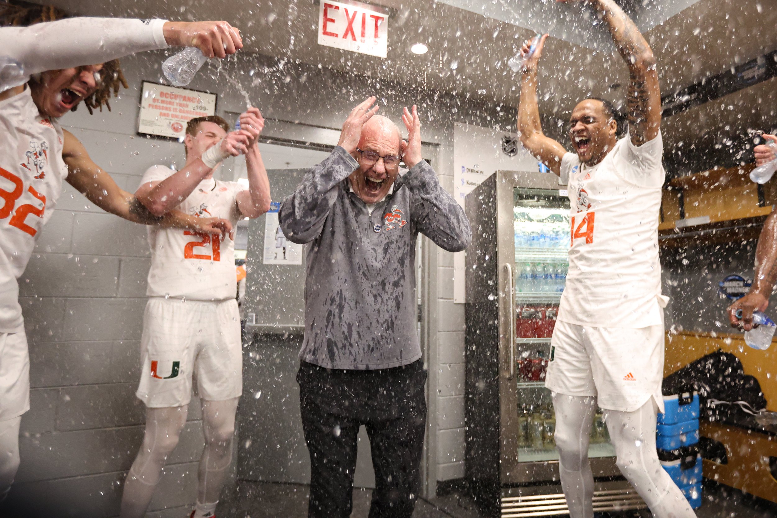  CHICAGO, IL - MARCH 25: Head coach Jim Larrañaga of the Miami (Fl) Hurricanes celebrates with his team after defeating the Iowa State Cyclones during the Sweet 16 round of the 2022 NCAA Men’s Basketball Tournament held at United Center on March 25, 