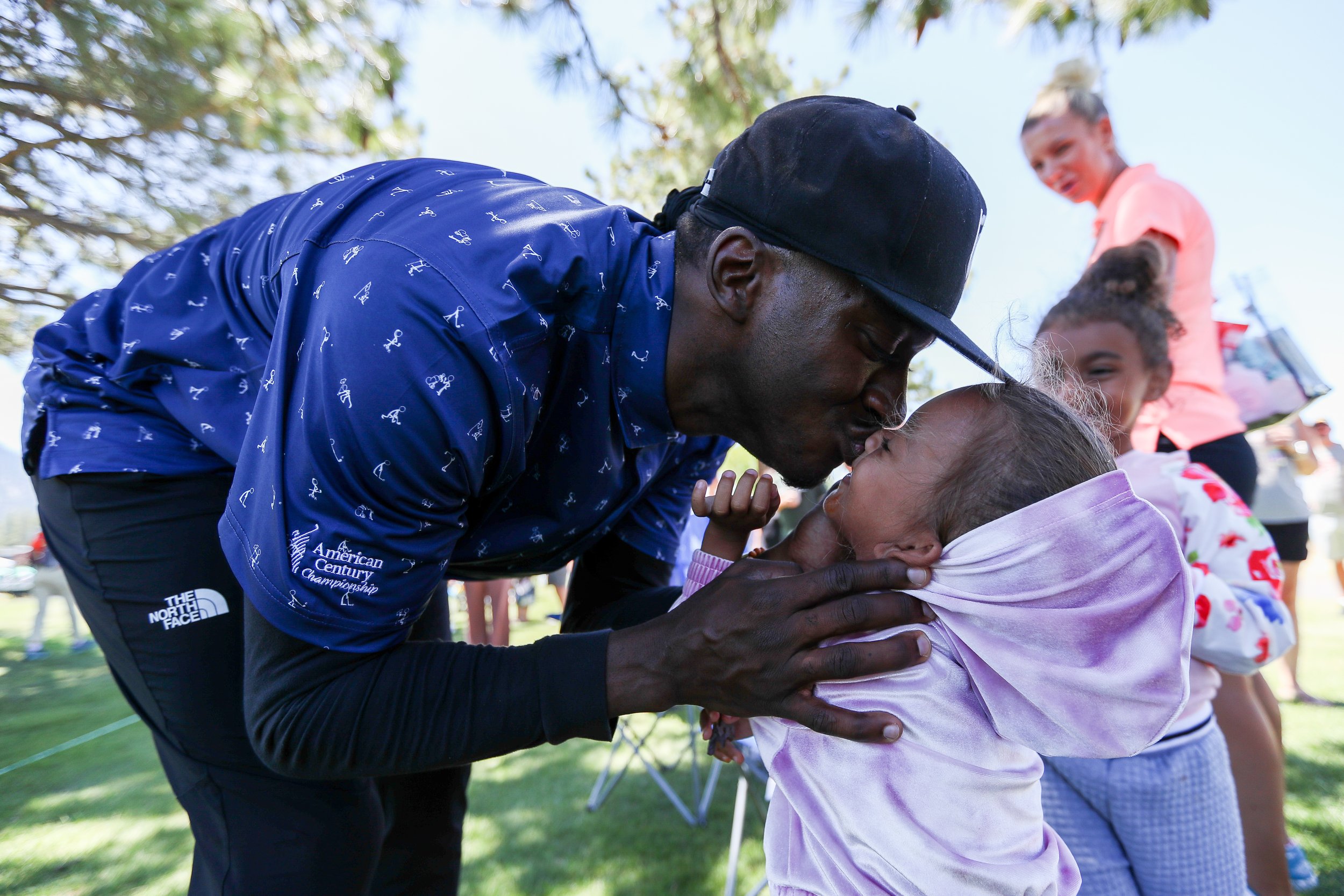  STATELINE, NV - JULY 09: NFL football player Robert Griffin III kisses his daughter while walking through hole 18 during Round Two of the 2022 American Century Championship at Edgewood Tahoe Golf Course on July 9, 2022 in Stateline, Nevada.  