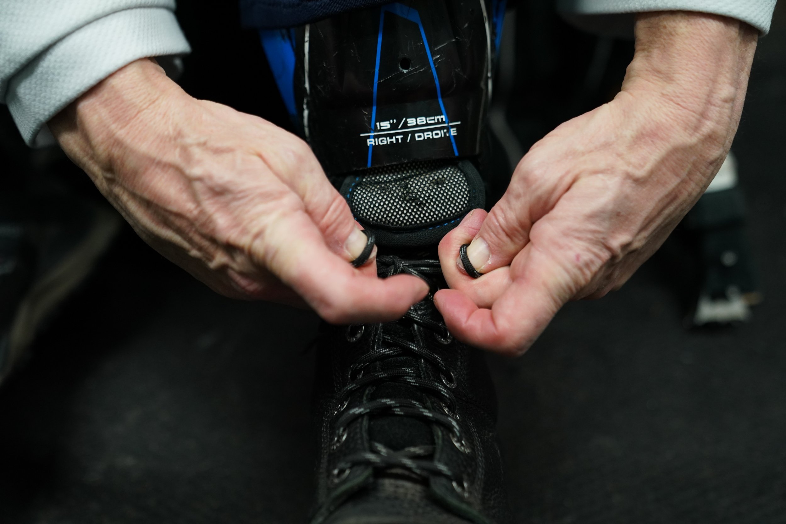  A sled hockey player ties his skates before competing in the the Empire State Winter Games in Lake Placid, NY on Thursday, February 2, 2023. (Photo by Isaiah Vazquez) 