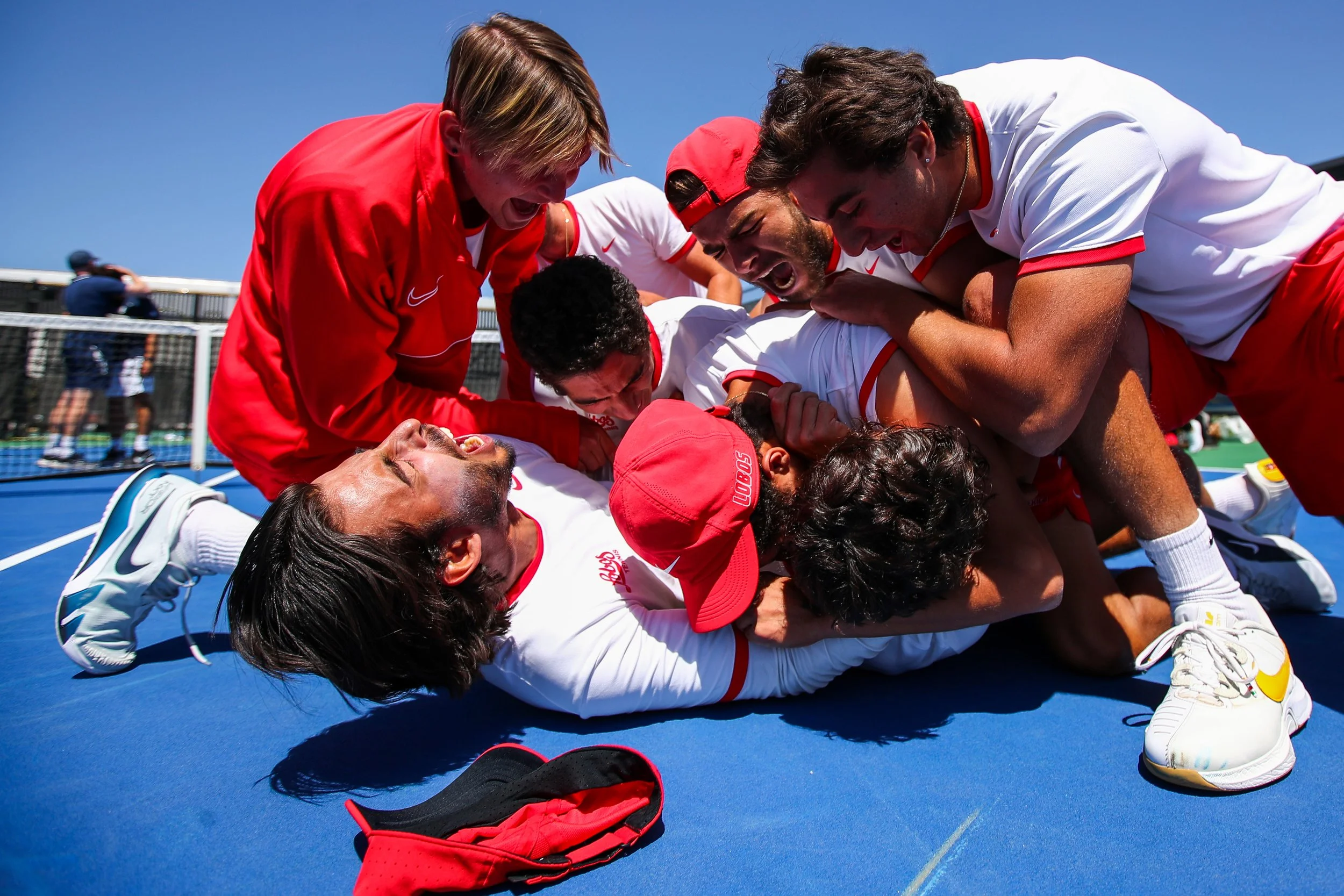  30 APR 2022: The New Mexico Lobos celebrate after coming back to defeat Utah State 4-3 in the Semifinals of the Mountain West Men’s Tennis Championships at Air Force Academy in Colorado Springs, CO on April 30, 2022.

The 2022 Mountain West Men's Te
