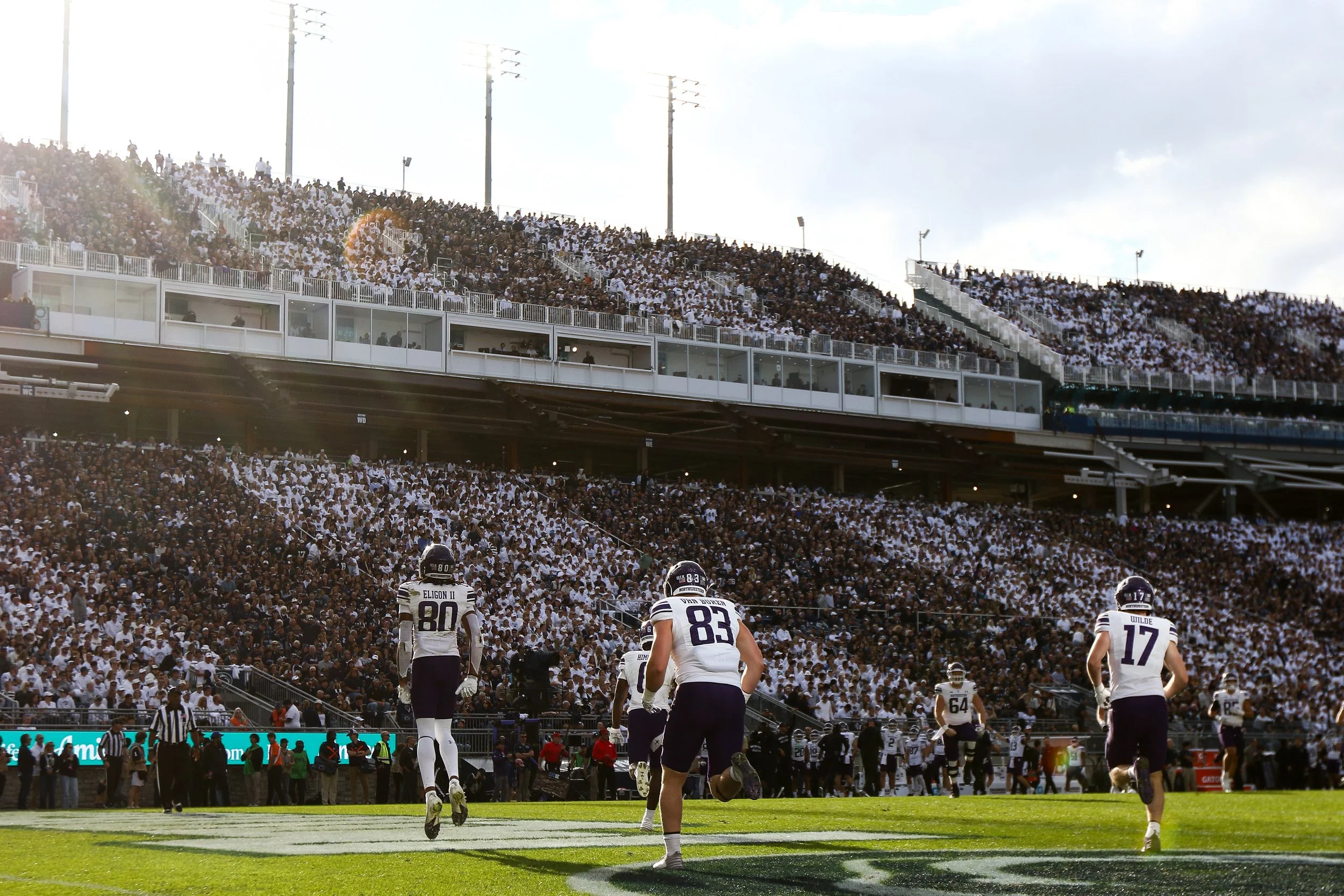  STATE COLLEGE, PENNSYLVANIA - OCTOBER 11: Hayden Eligon II #80 of the Northwestern Wildcats, Blake van Buren #83 of the Northwestern Wildcats, and Griffin Wilde #17 of the Northwestern Wildcats react after a touchdown during the second quarter again