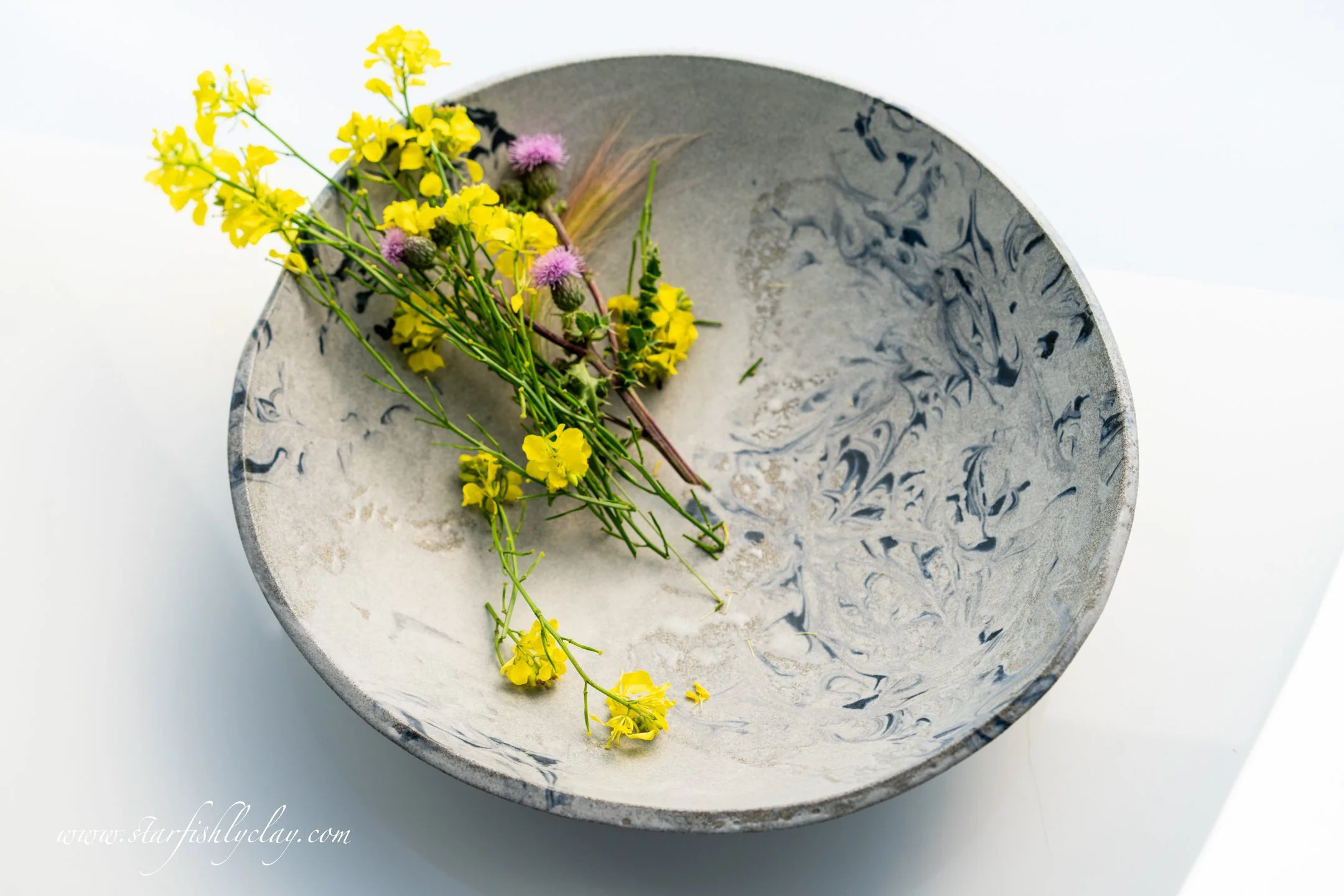 This bowl has a beautiful, organic marbled texture with a soft, earthy glaze. Handmade in YYC. Calgary. Alberta. Made in Canada. Handmade Ceramics. Locally made Pottery.
