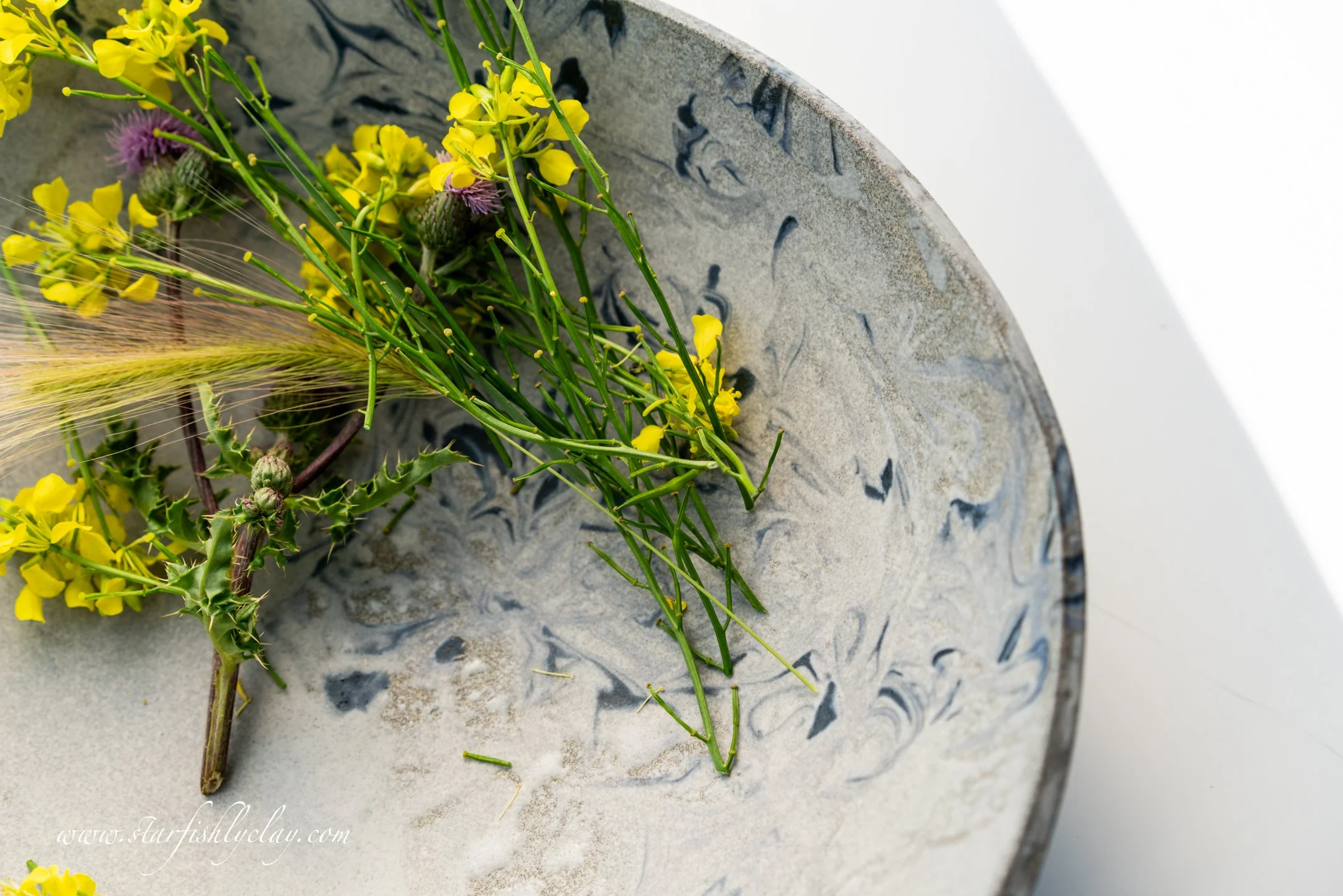 This bowl has a beautiful, organic marbled texture with a soft, earthy glaze. Handmade in YYC. Calgary. Alberta. Made in Canada. Handmade Ceramics. Locally made Pottery.