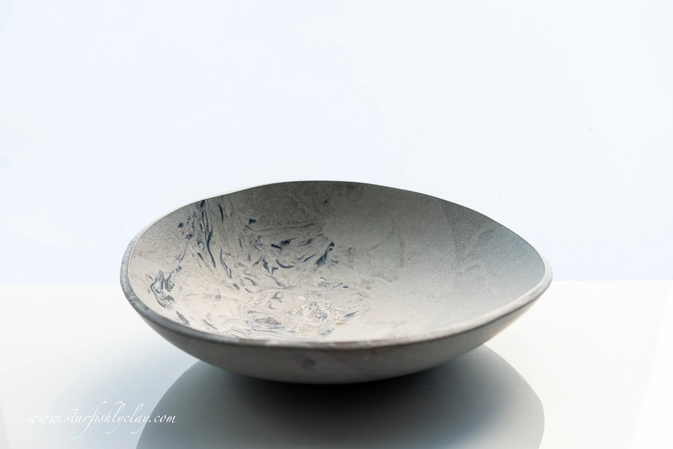 This bowl has a beautiful, organic marbled texture with a soft, earthy glaze. Handmade in YYC. Calgary. Alberta. Made in Canada. Handmade Ceramics. Locally made Pottery.