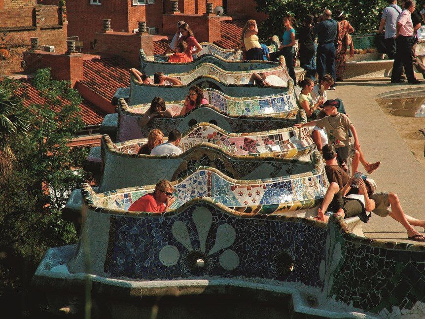  Sun yourself on the world’s longest park bench at Park Guell - it’s covered in colorful mosaics made from broken plates, cups, and dishes 