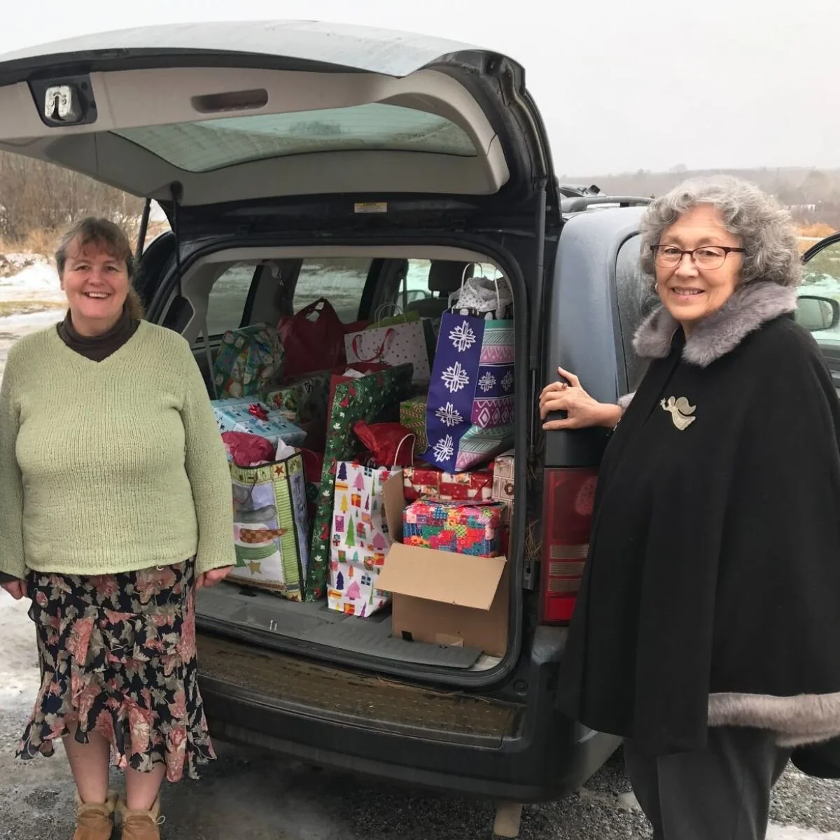 Friends from Chestnut Street Baptist Church delivering an SUV full of gifts last year!