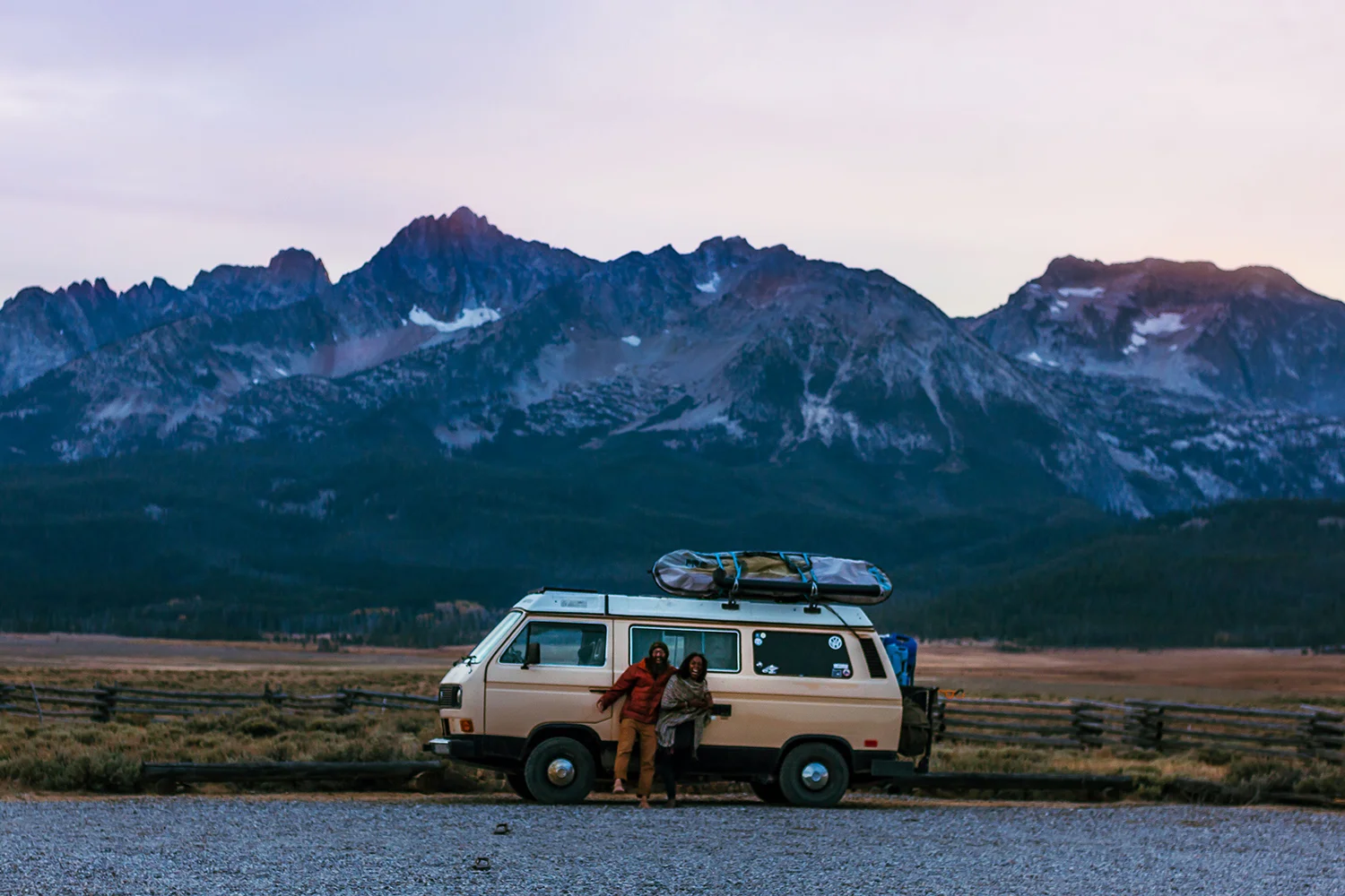 Noami and her husband Dustin in front of their VW Vanagon at blue hour