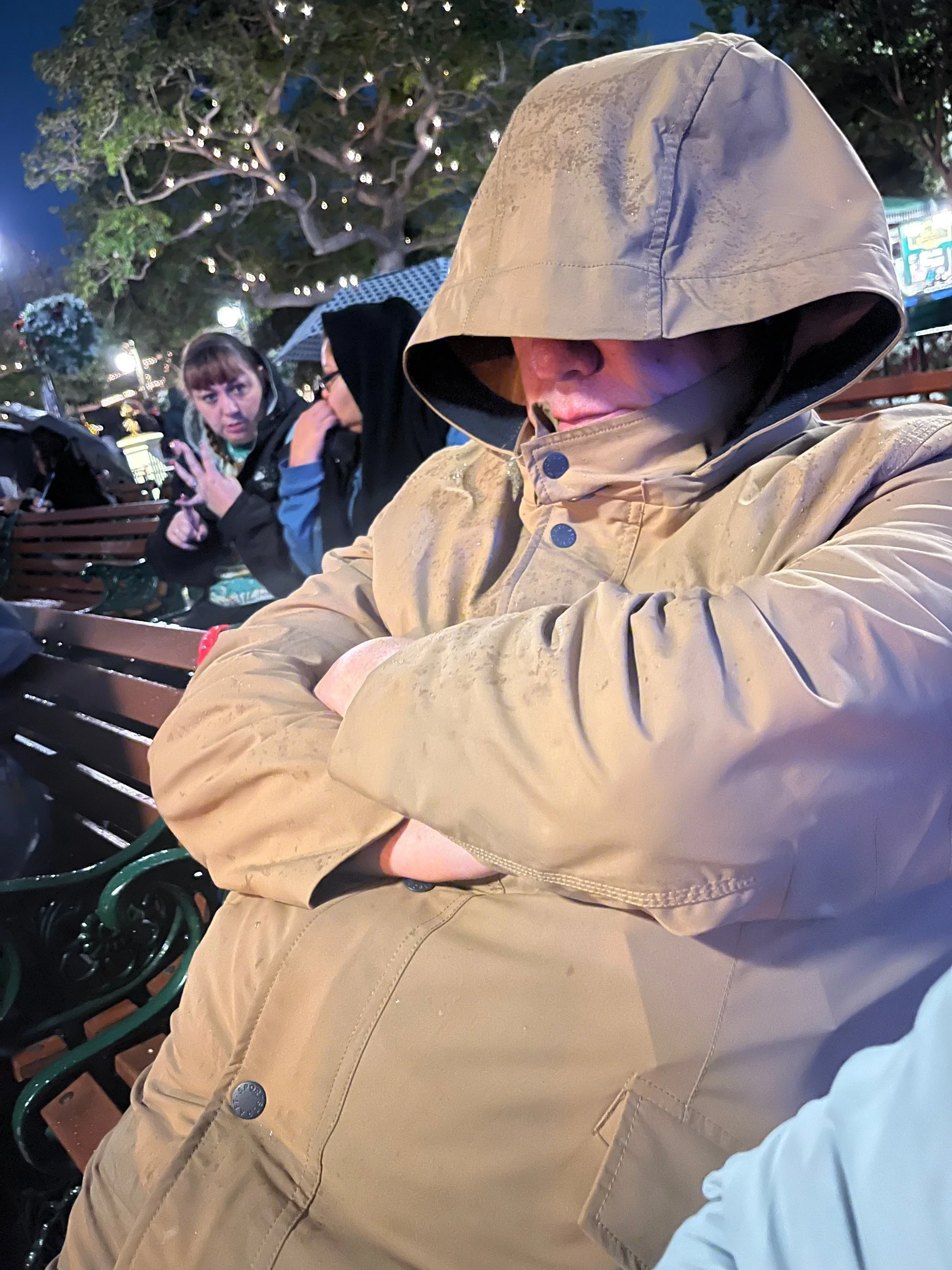 One very happy man waiting in the rain for the parade to start