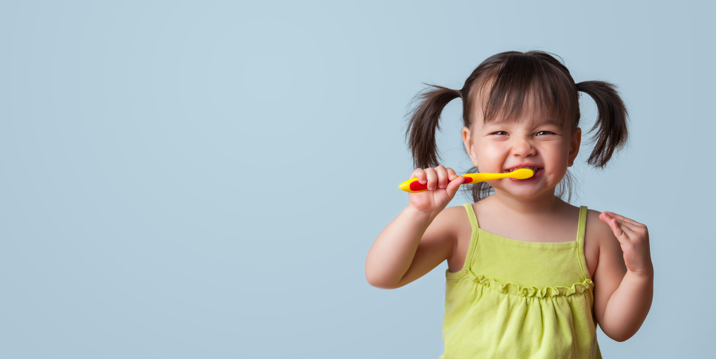 young_girls_with_pigtails_brushing_her_teeth_website-03d.jpg