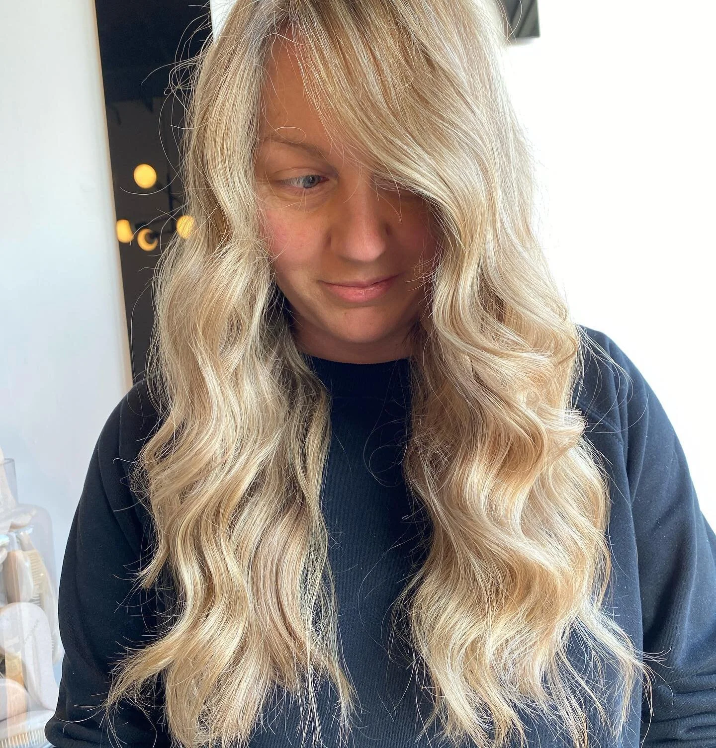 Beachy goddess is what we are serving up and We are so here for it! Warm up your winter and find the bright side of blonde this color was achieved with emvhair’s signature foil placement using 9 levels powder lightener & 6% then glossed per