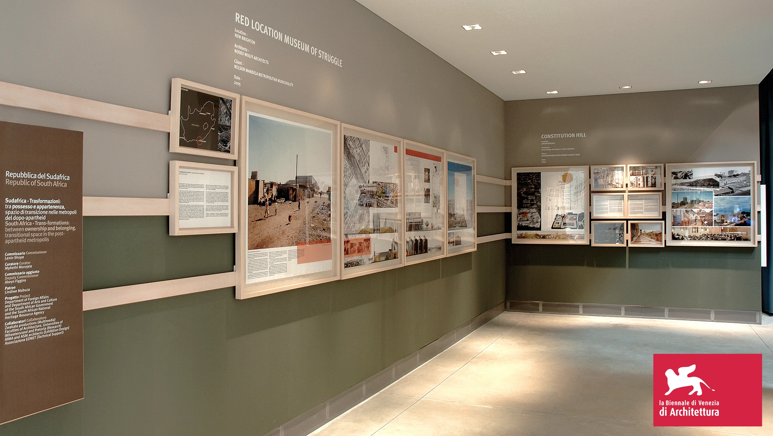 Exhibition design for the South African national exhibition at the Venice Architecture Biennale – titled Between Ownership and Belonging: Transitional Space in the Post-Apartheid Metropolis. Curator: Mphethi Morojele, MMA Architects Commissioned: South African Department of Arts and Culture and Department of Foreign Affairs The exhibition featured 12 distinct projects organised around the exhibition title concept: Between Ownership and Belonging: Transitional Space in the Post-Apartheid Metropolis. The functional, modular design of the box-framed elements feature a three tier hanging system that the 1m and A3 box frames are attached to. Angled slats on the back of the frames rest on the three angled, wooden tracks fixed to the walls. This design allows the box frames to be freely moved around and arranged in random, geometric compositions. These devices are annotated by vinyl signage; vinyl wallpapers; explanatory texts; audiovisual components and location maps. The wood and perspex box frames also allow easy transport, as the exhibition toured to the Royal Institute of British Architects (RIBA) in London and Netherlands Architecture Institute (Nai) after the Biennale.