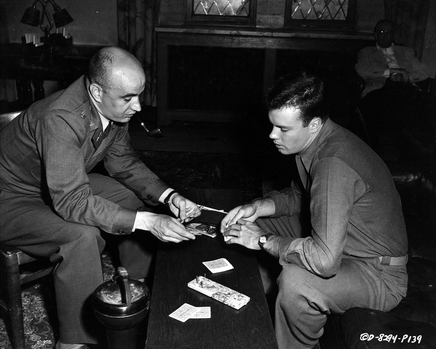  Publicity Photo, Columbia Pictures, West Point, 1954 “OFF-DUTY - Bob Francis (right) plays a game of cribbage with Major George Pappas between shooting scenes on location….” 