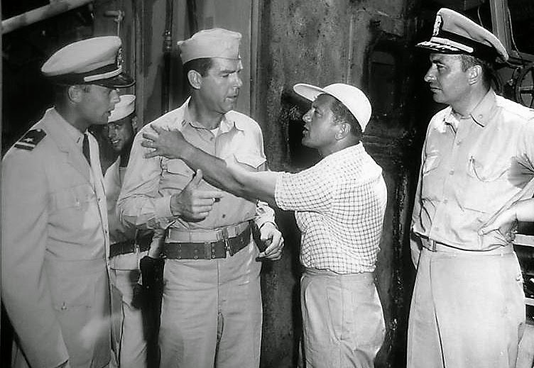  Bob and Fred MacMurray receive direction from Edward Dmytryk. At far right is Commander James Shaw, Technical Adviser. Columbia Pictures, Pearl Harbor, Summer 1953. This and the following photo (an outtake) were made during scene when Ensign Keith f