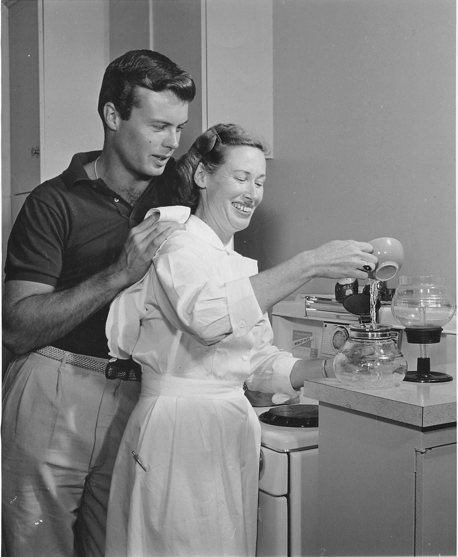  Bob with sister, Lillian, c. 1955  Photo taken in Spring 1955 as part of a “Bob’s new apartment” photo story, e.g., Bob’s sister teaches him how to make his own coffee. Evidently, she came by his apartment on her way to or from her nursing job and f