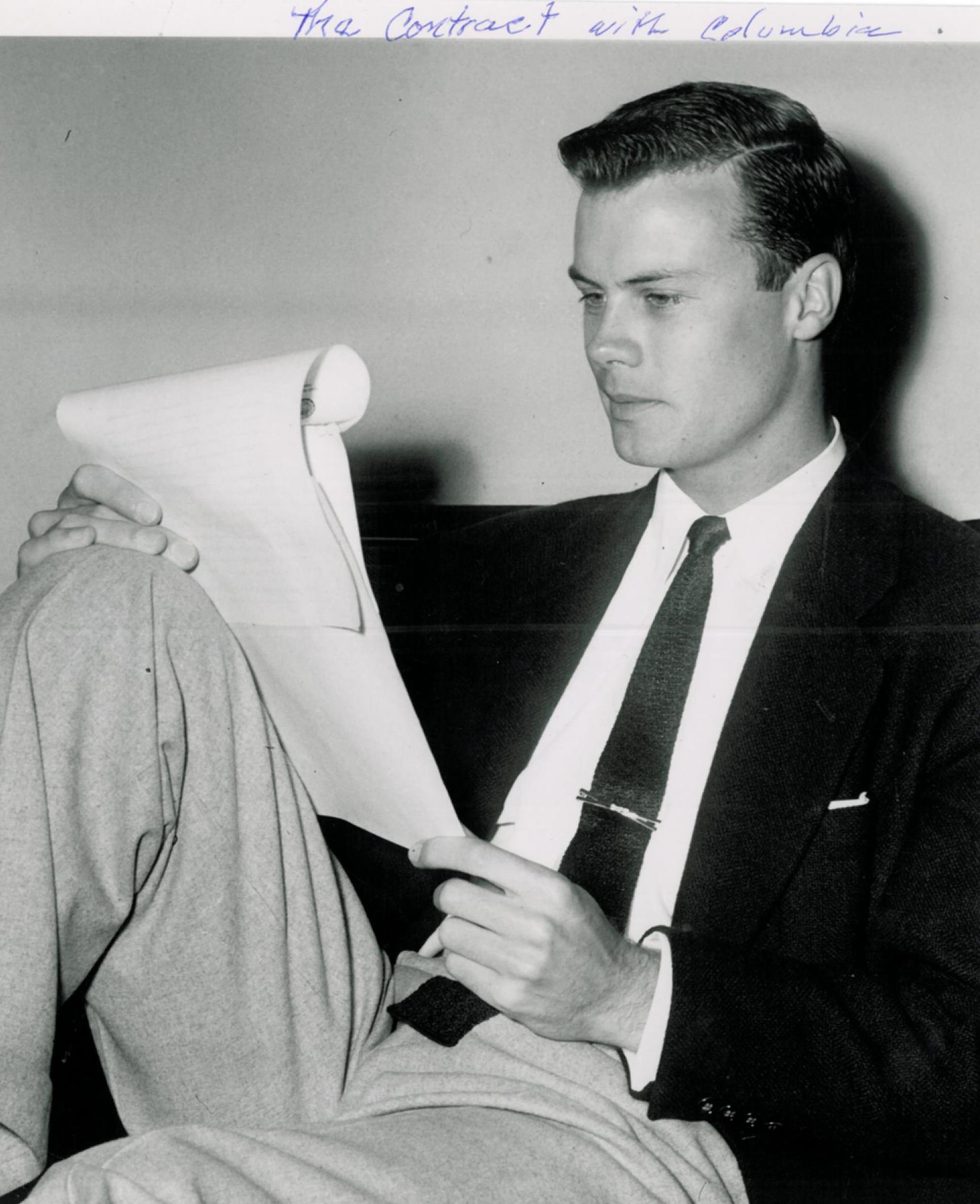  Spring 1953  Bob with his Columbia contract. Appeared in  Pasadena Star-News , April 23, 1953. No caption or story available.  Bob’s first contract probably started him at $75 per week with studio options every six months and a slight salary boost w