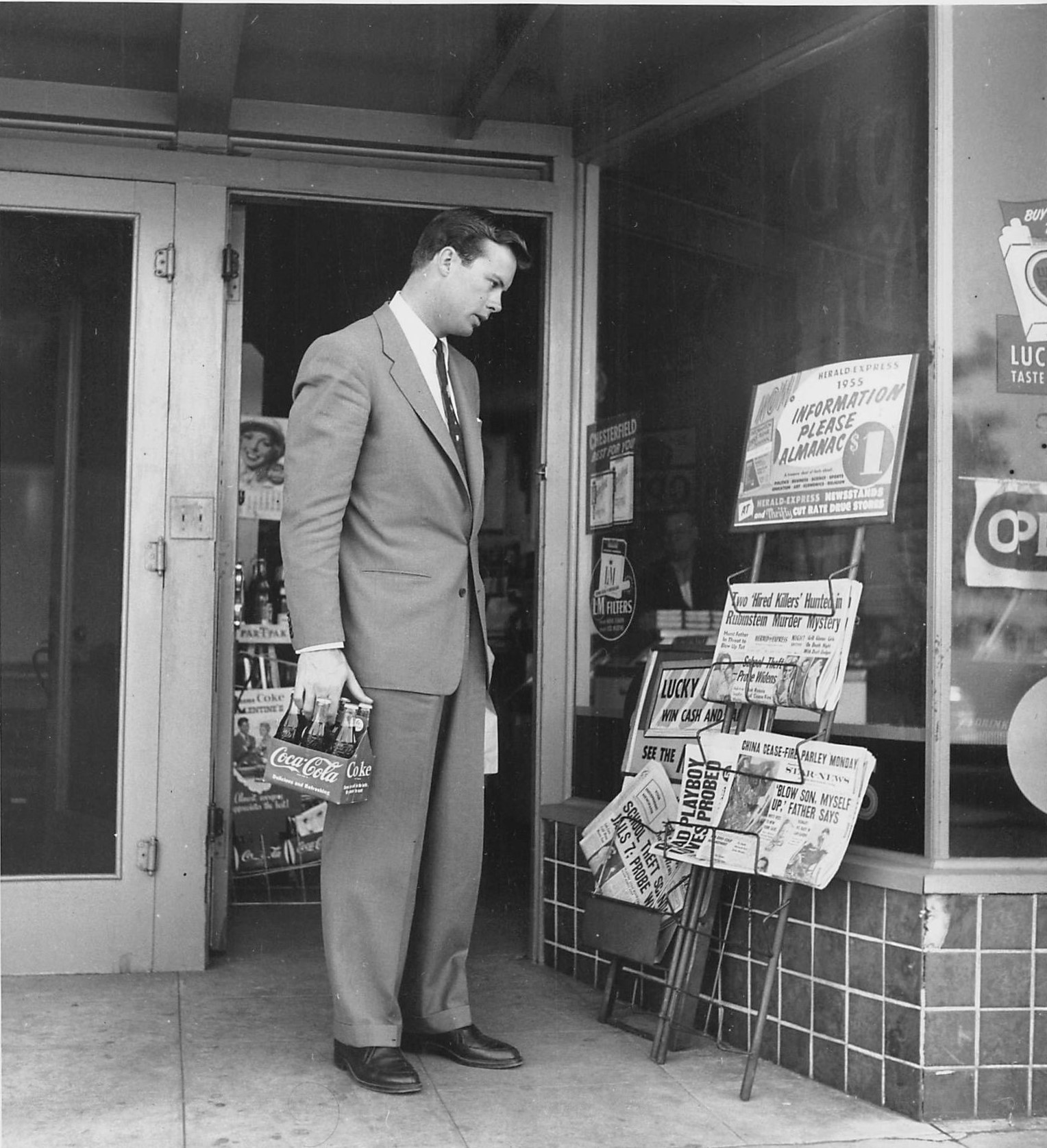  Jan. 28, 1955, Pasadena, Calif.  Photo by Larry Barberi for Globe Photos. May have appeared in  Screenland , July 1955, as part of “Weekend with the Folks” photo story (also titled “A Day to Loaf” prior to publication). The location was a grocery st