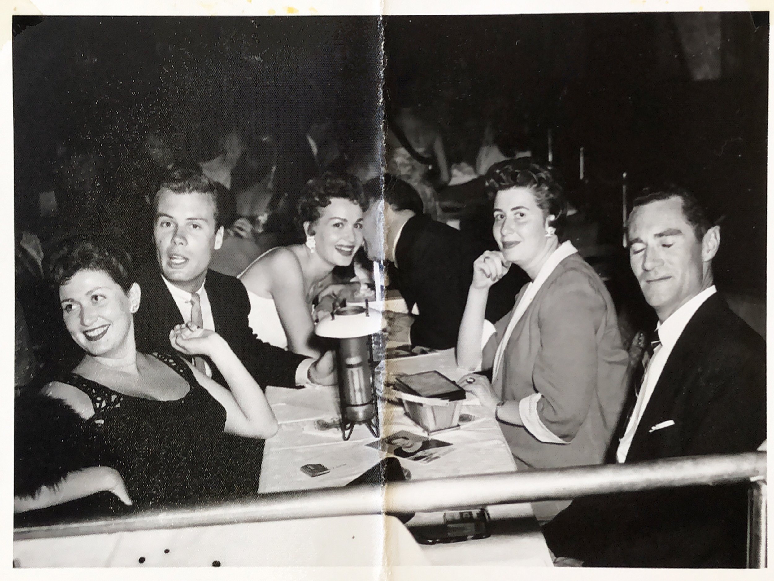  Bob's brother Bill may have gone with him to Las Vegas.  Bill (eyes closed) and Bob appear to be seated at a stage-side table in a nightclub (probably The Sands), and possibly with people they did not know. No others in photo identified. The Robins 