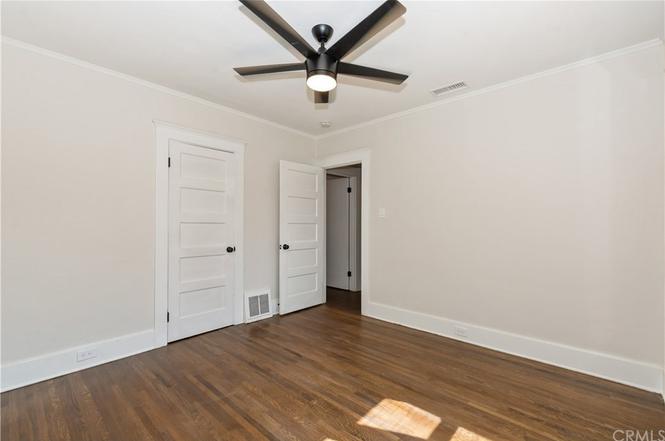  212, front bedroom, door for closet and door into hallway for bath (to left) and living room, c. 2018-2019 