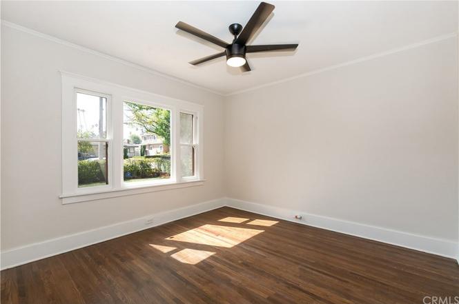  212, front bedroom, c. 2018-2019. Windows look out onto S. Grand Oaks Ave. 