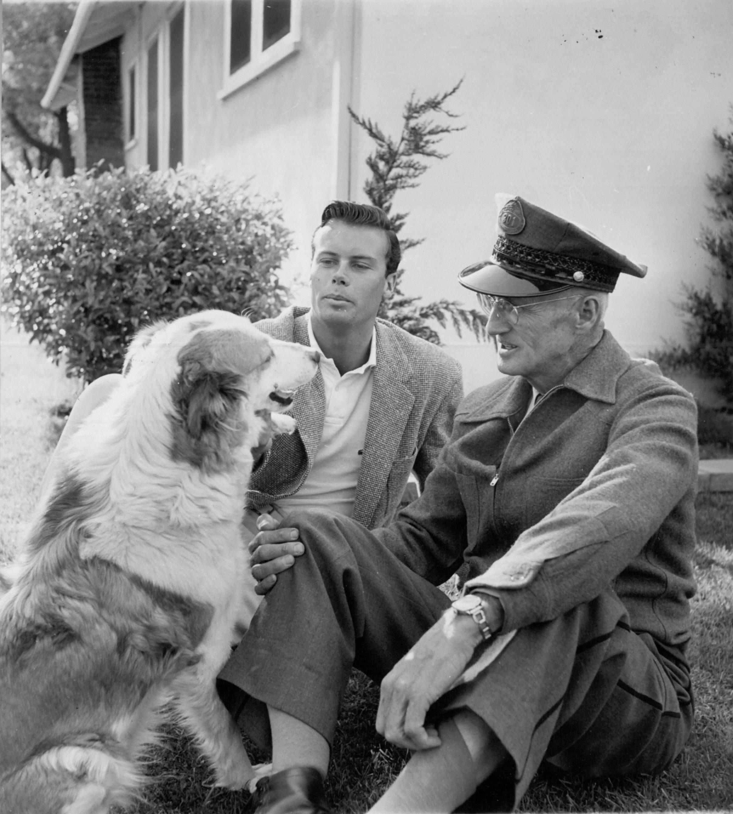  212, Bob with his father and one of the dogs named Chummy, c. Jan. 1955. Photo shows the right side of the house along Del Mar Blvd.  Don Ornitz of Globe Photos, New York City, made this photo and several others in which Bob wears these trousers and