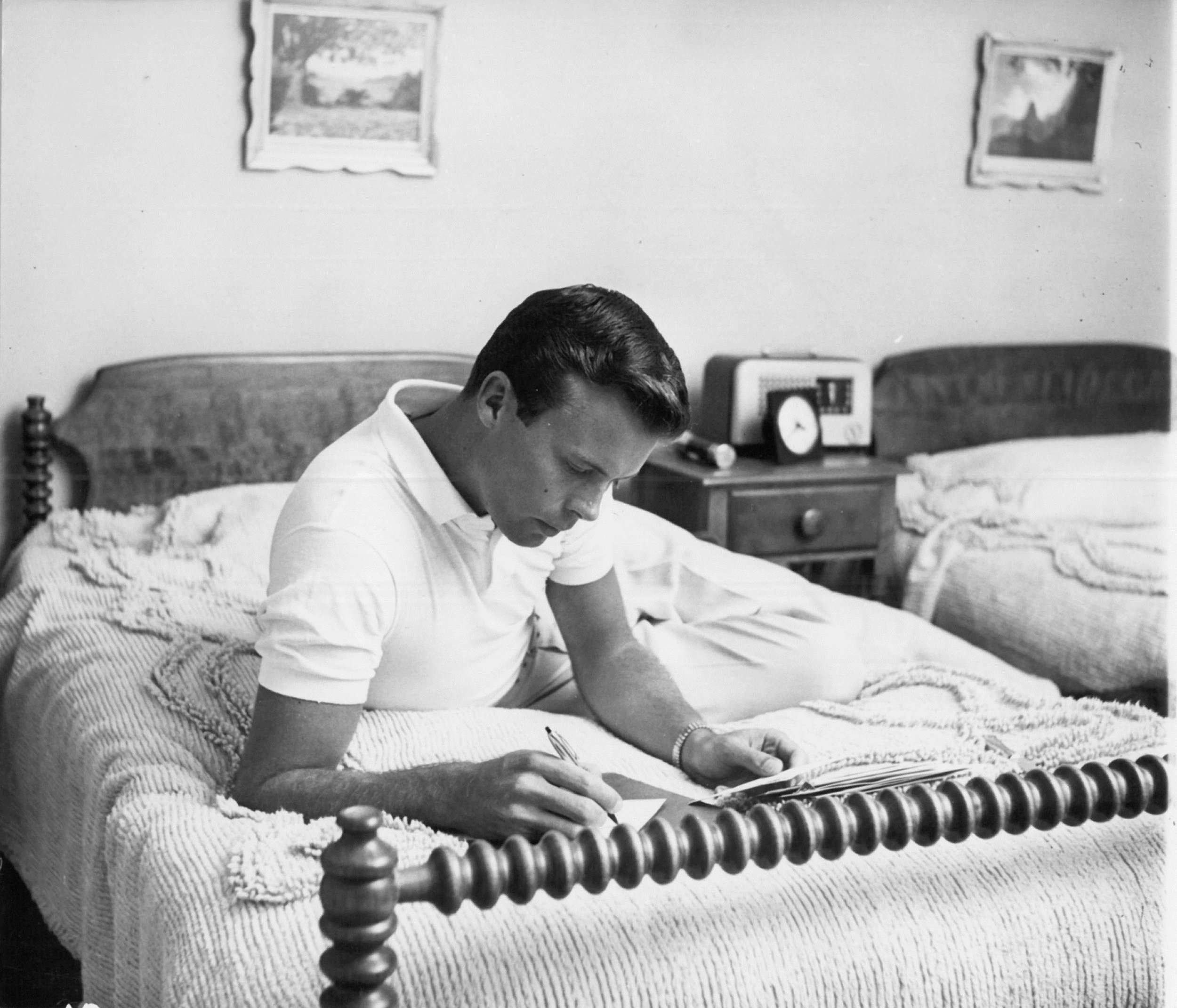  Bob in his bedroom, c. Jan 1955?  Don Ornitz of Globe Photos, New York City, made this photo and several others in which Bob wears these trousers and a plain Lacoste tennis shirt with a crocodile logo embroidered on the chest. 