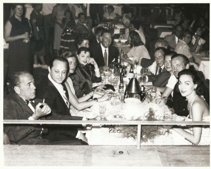  The Sands Hotel, c. 1955  From left: Humphrey Bogart, Sid Luff (Judy Garland’s husband), Lauren Bacall, Judy Garland, unknown woman, Jack Entratter (General Manager, The Sands), unknown man, Frank Sinatra, unknown woman, David Niven, and his wife,  