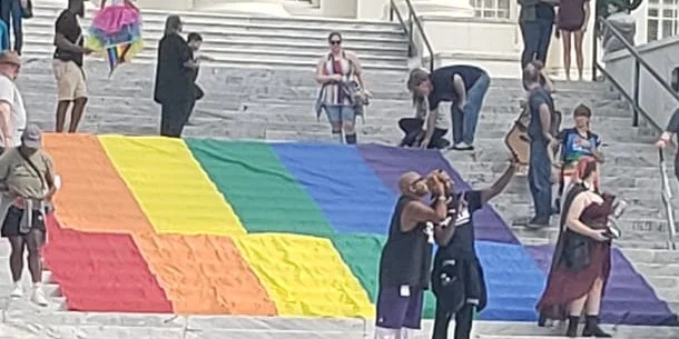rally steps selfies with the flag.jpg