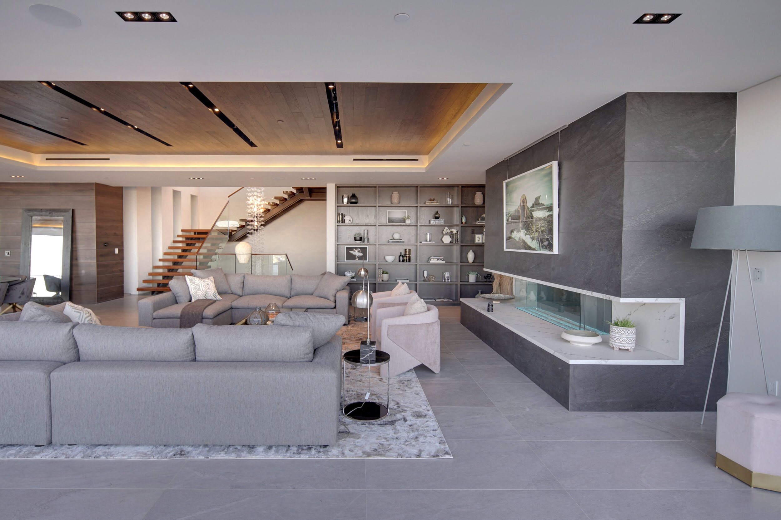 Los Tilos Living with Staircase and Fireplace.jpg
