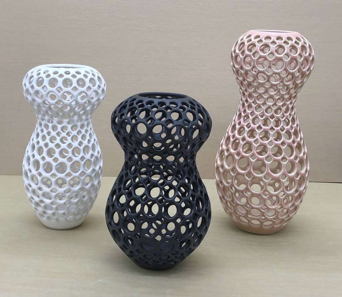 Trio of white, black and blush pierced tabletop sculptures in the Femme Collection by Lynne Meade.