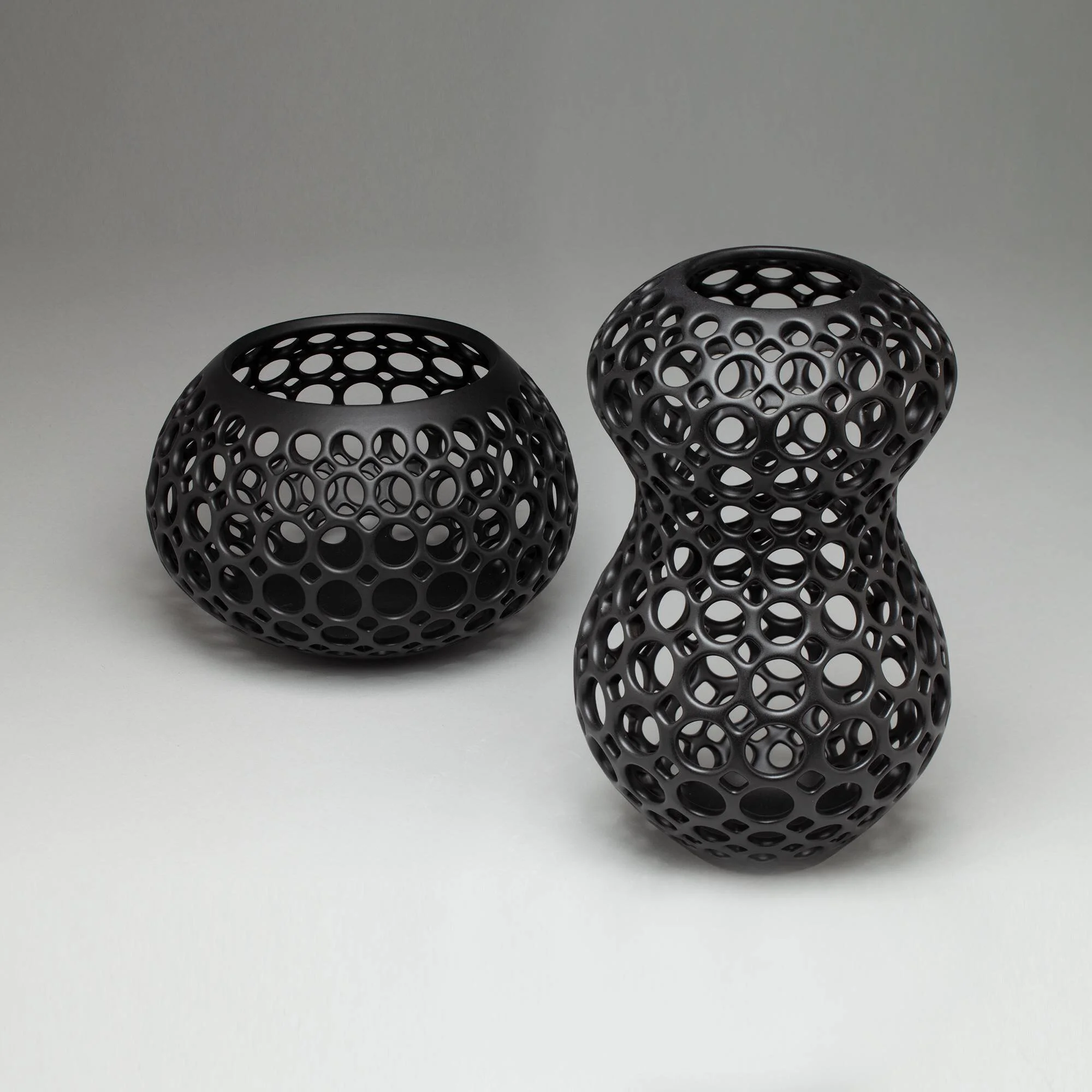 Yvette black tabletop sculpture in Femme Collection and wide teardrop vessel in black by Lynne Meade
