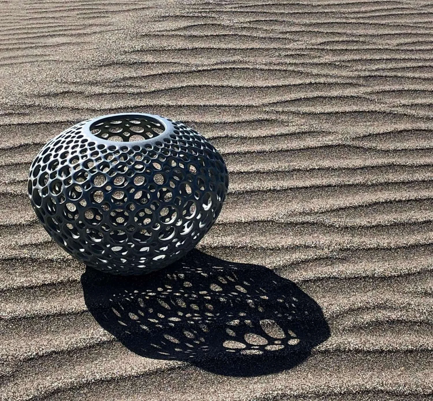 Pierced lace Orb Vessel - Blue/Green on California beach