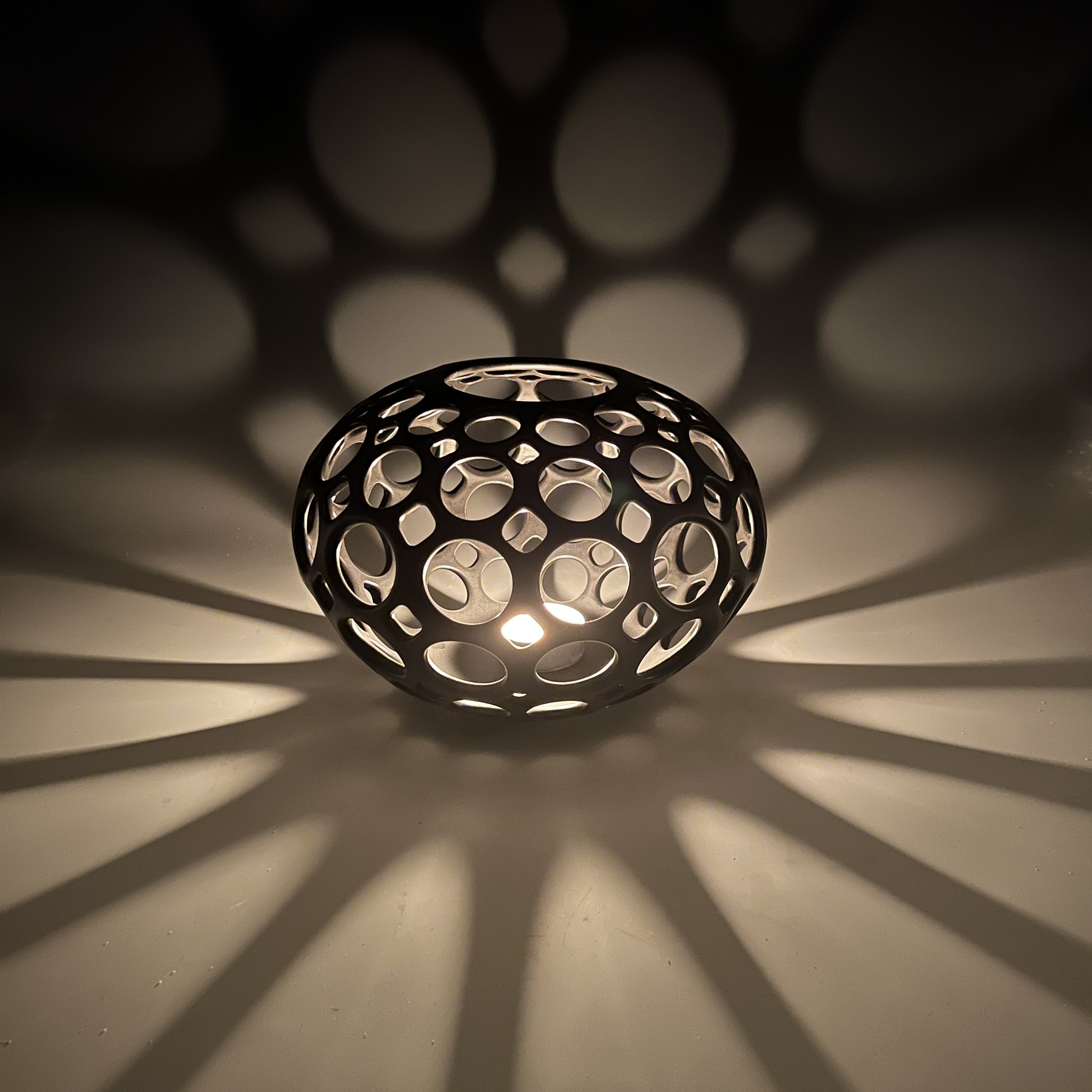 lynne_meade_openwork_orb_black_candle.JPG
