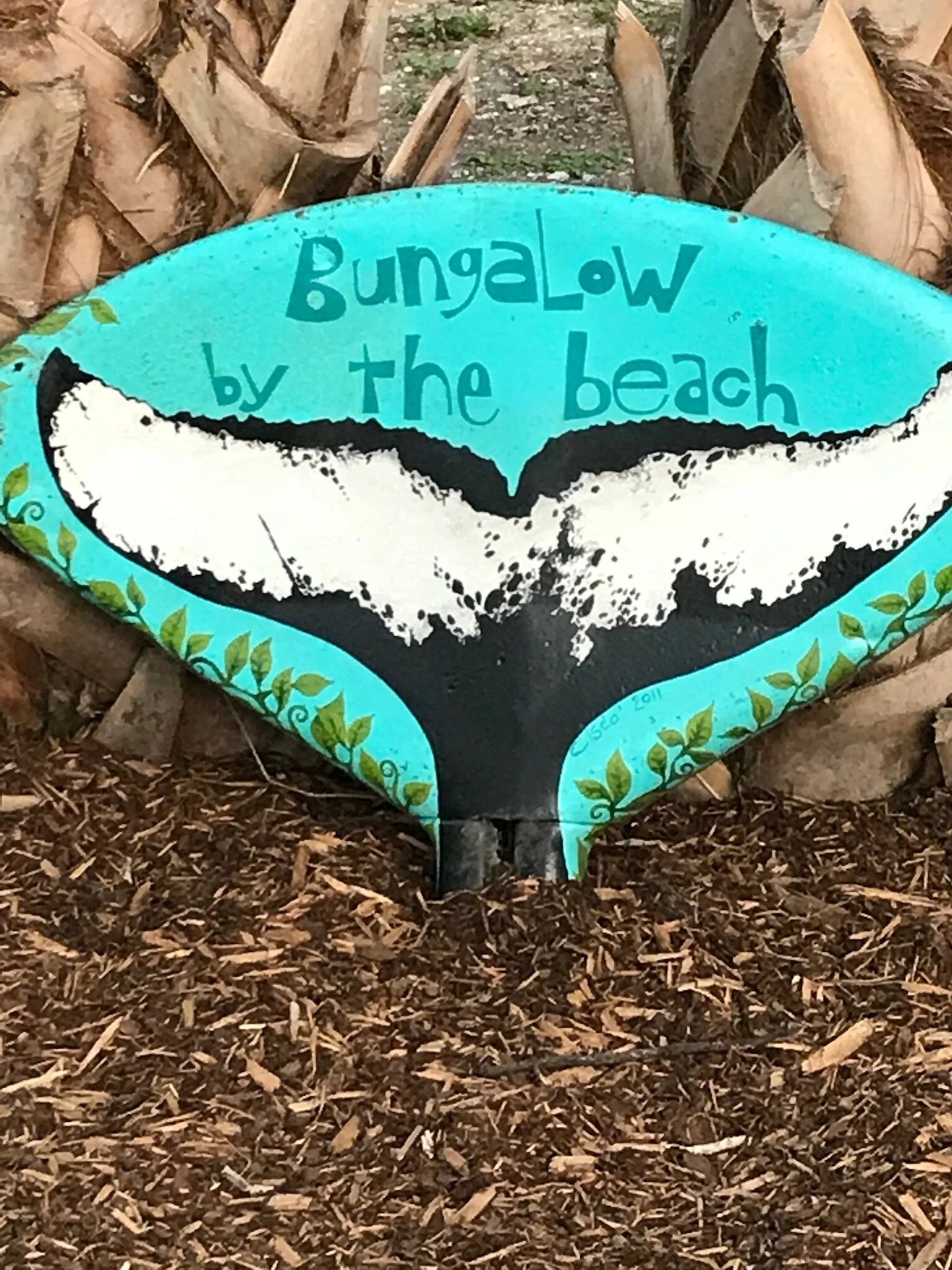 This old tractor seat was painted by William Hawkins, and it hung on the front of The Bungalow for many years. It is currently adorning the backyard.