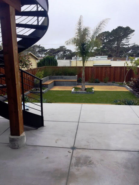  Back yard from lower unit with spiral stair to upper deck and upper unit. 