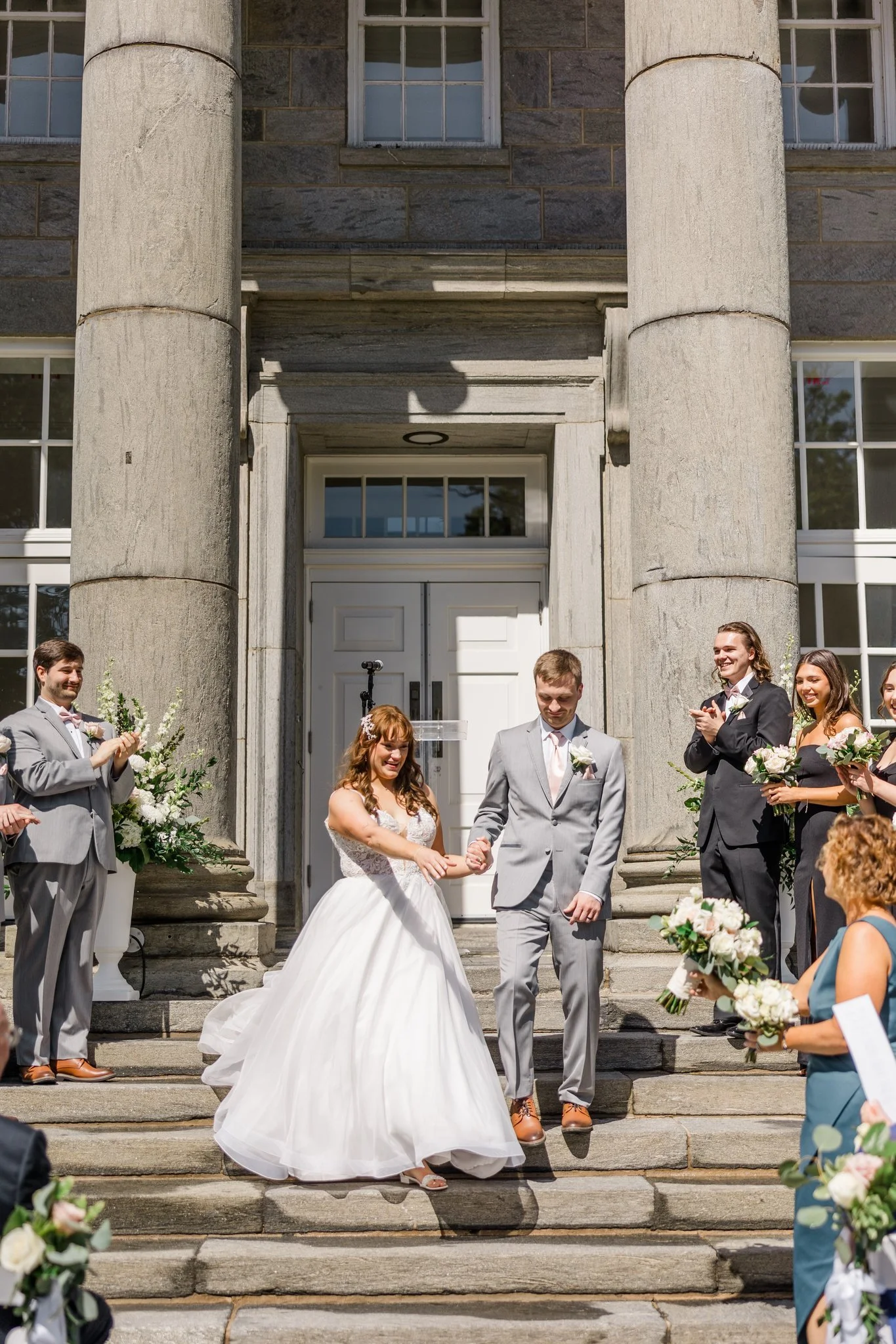 Beautiful pale pink and white bridal flowers at Ellis Preserve Ballroom on steps