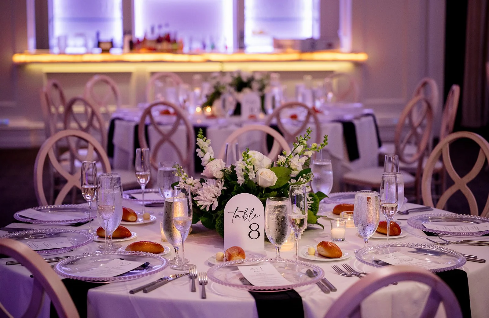 White floral centerpiece with roses, hydrangea, snap dragon, daisies, dianthus and greens