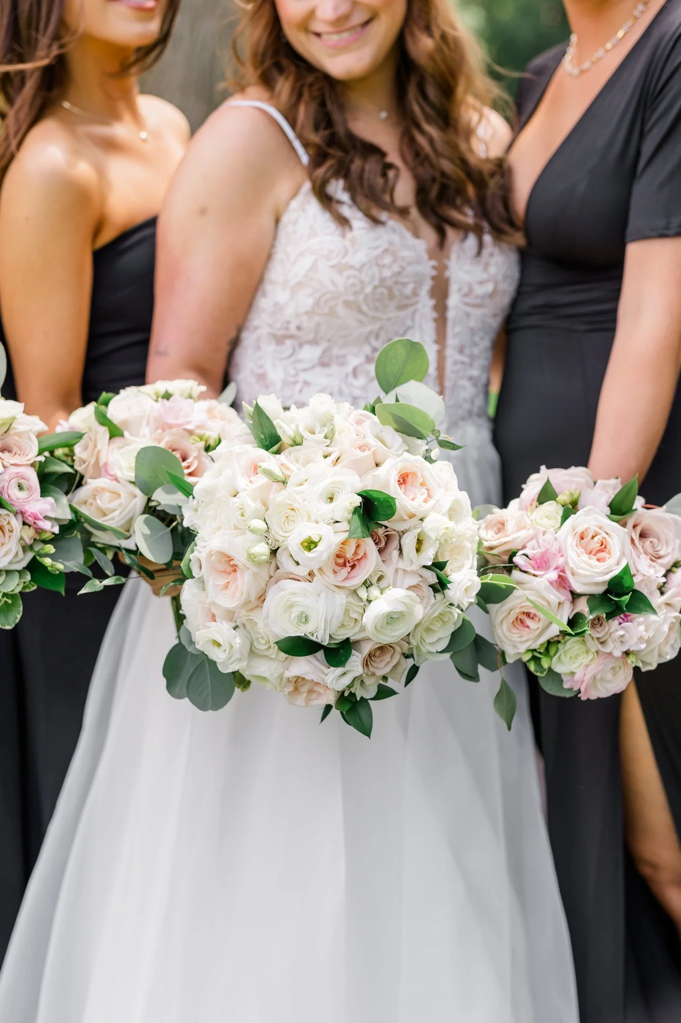 White ranunculus and pale pink bridal bouquet