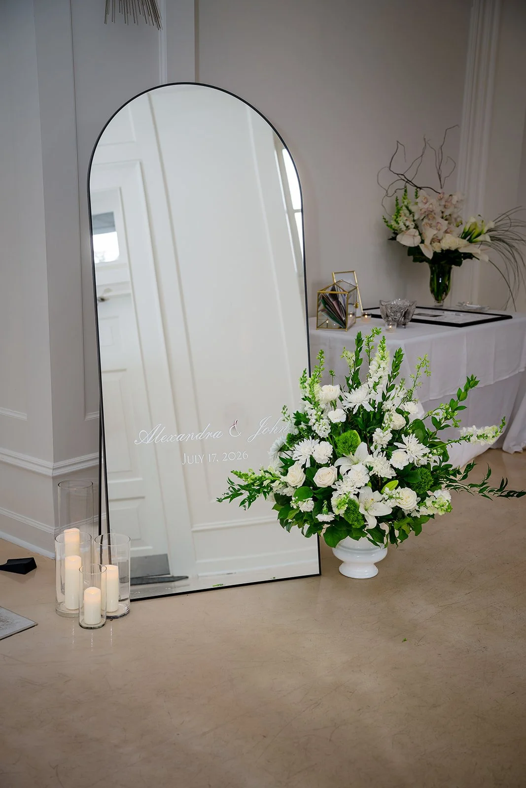 White flower arrangement and candles at Ellis Ballroom
