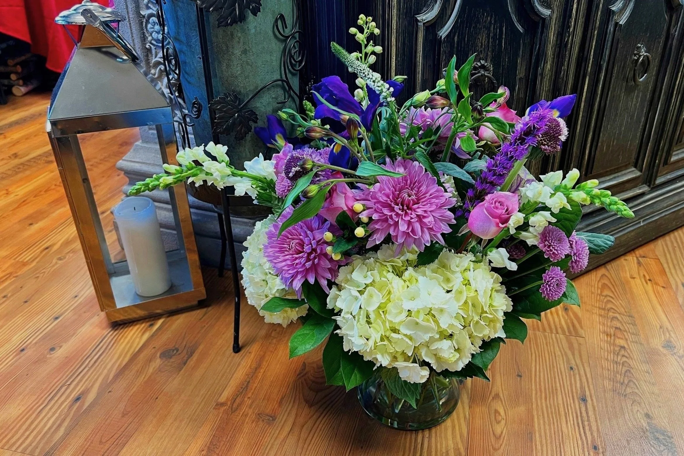 Beautiful Purple Flower Arrangement with White Hydrangea, Purple Mums, Snap Dragons, Purple Liatris and Greens