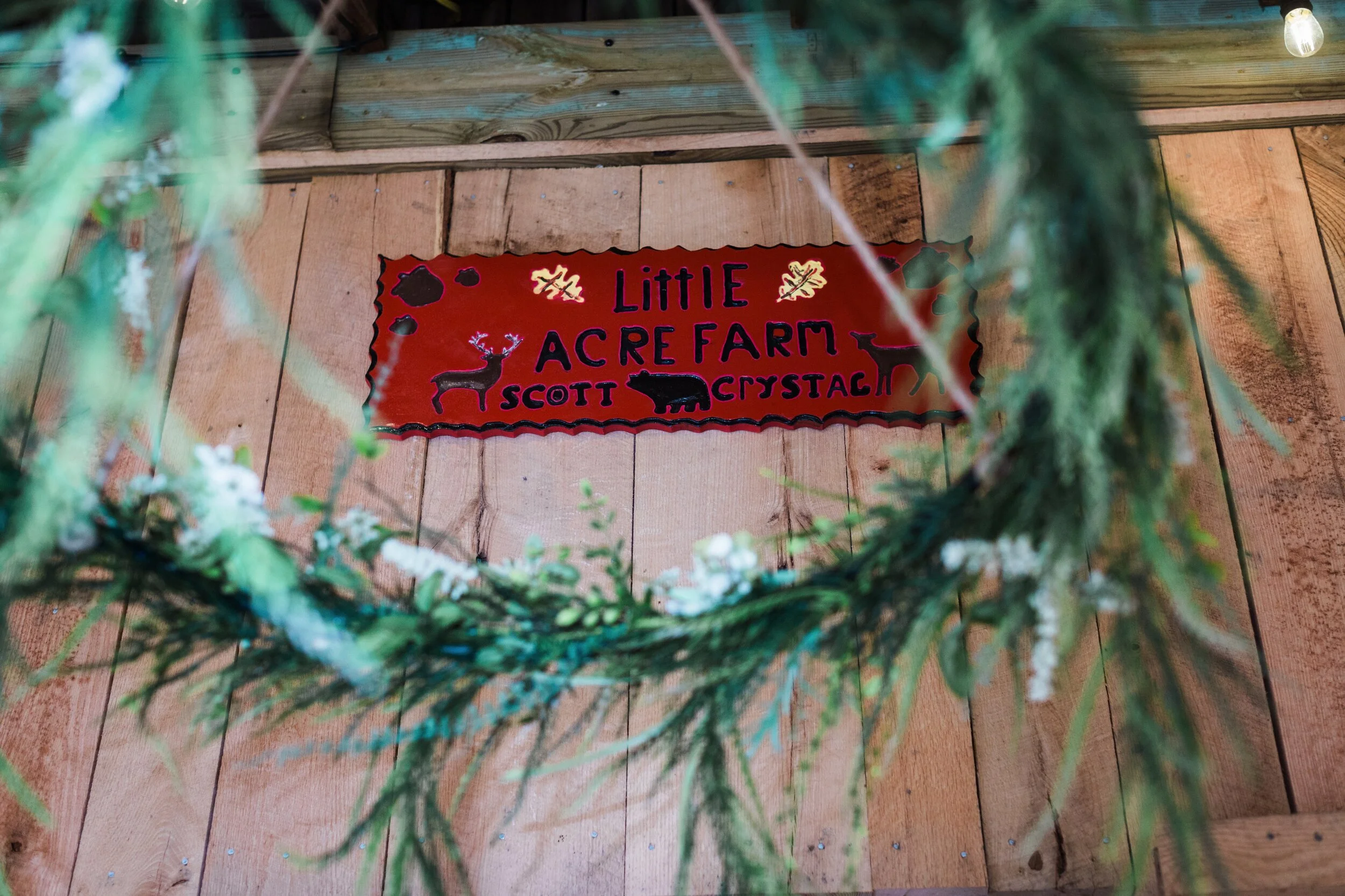 LARGE ROUND GREENERY HANGS ON PORCH  
