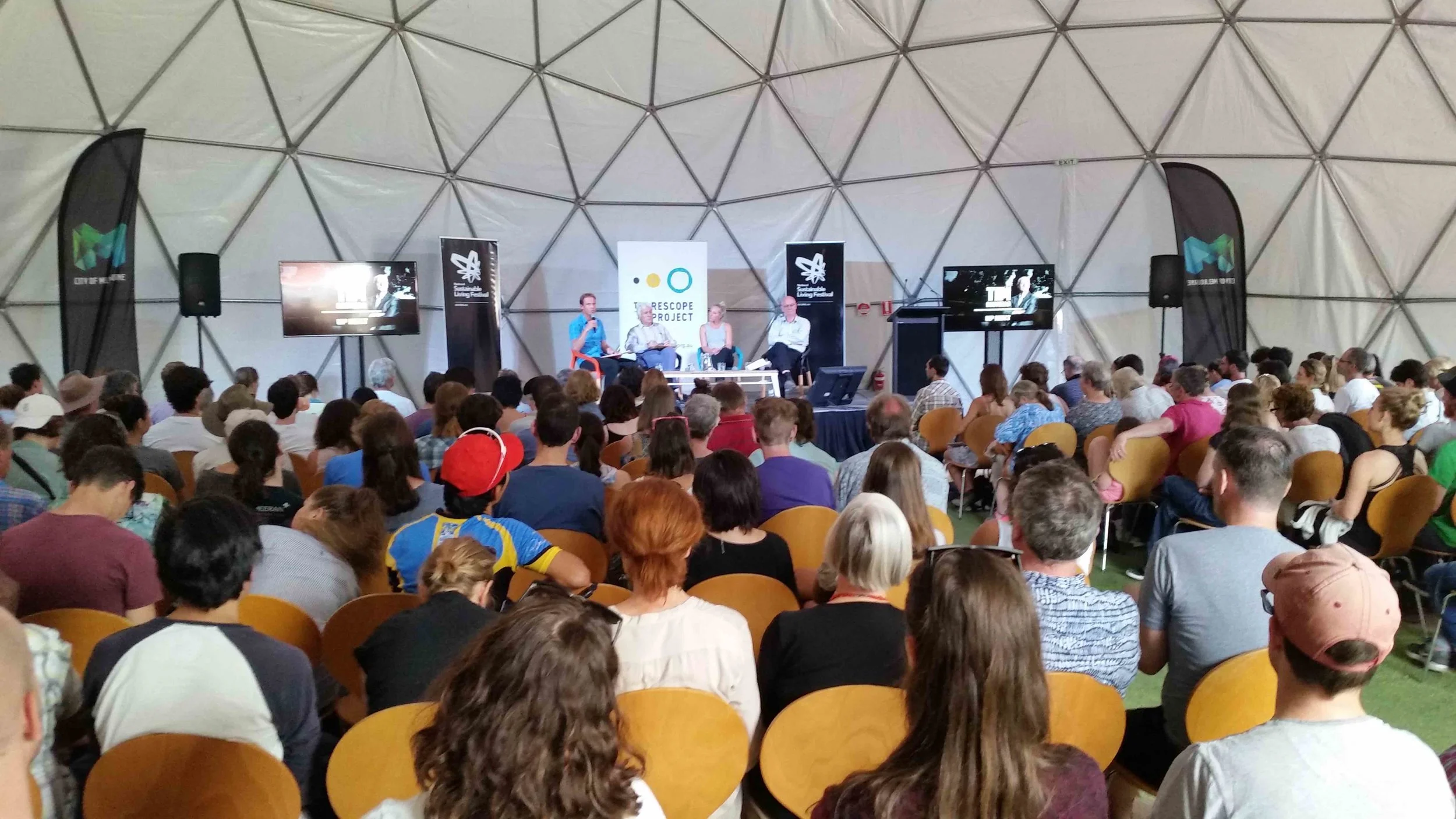 A panel event on Redefining Progress, at the 2017 National Sustainable Living Festival, in the heart of Melbourne, Australia. L-R on stage: Anthony James, Mike Salvaris, Melissa Weinberg & Tim Costello. Pic: John Lazzara.