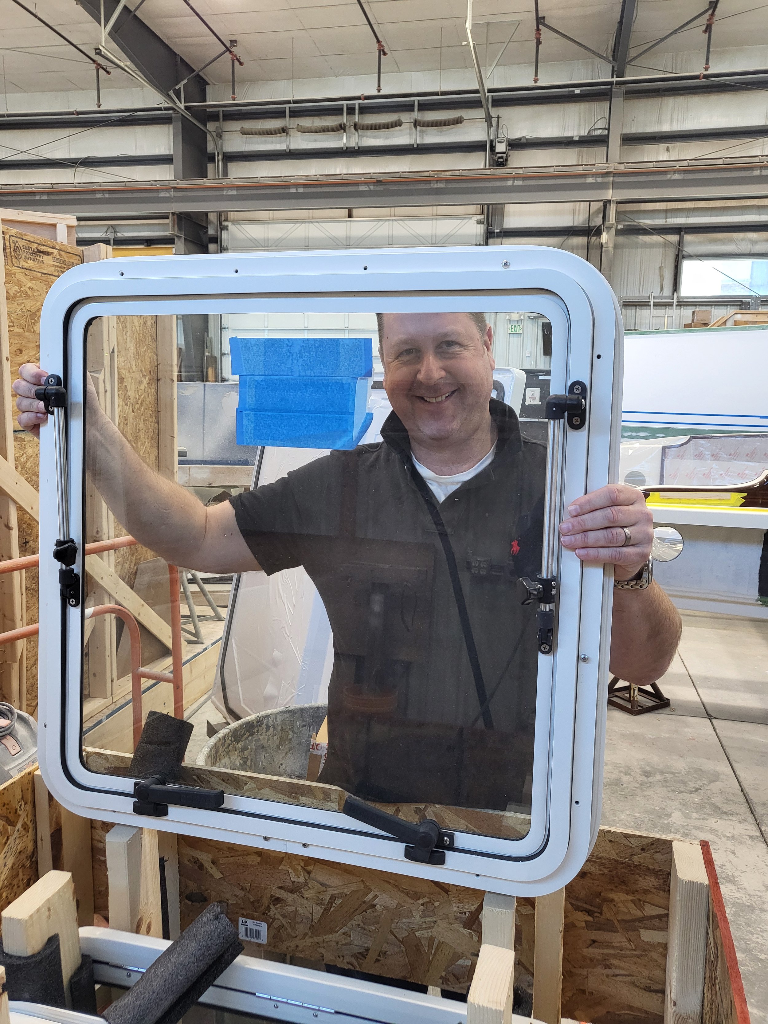    Nick Bannister is framed by one of the three windows for the front of the windscreen. March 2024   