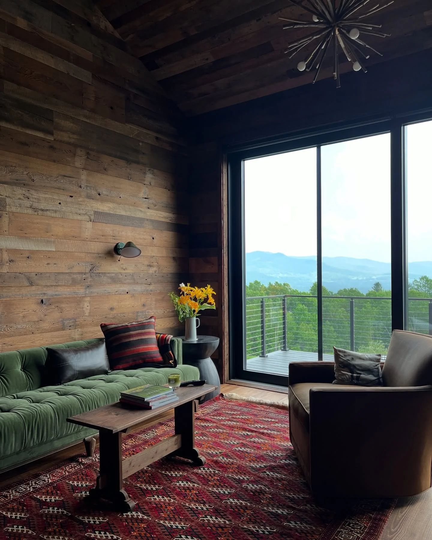 A glimpse into a mountain guest &ldquo;barn.&rdquo; Repurposed barn wood walls throughout create a cozy effect balanced by the beautiful views of the Green Mountains. 

Architect: @eld.architecture 
Builder: @redhousebuilding 

#vermonthomes #finehom
