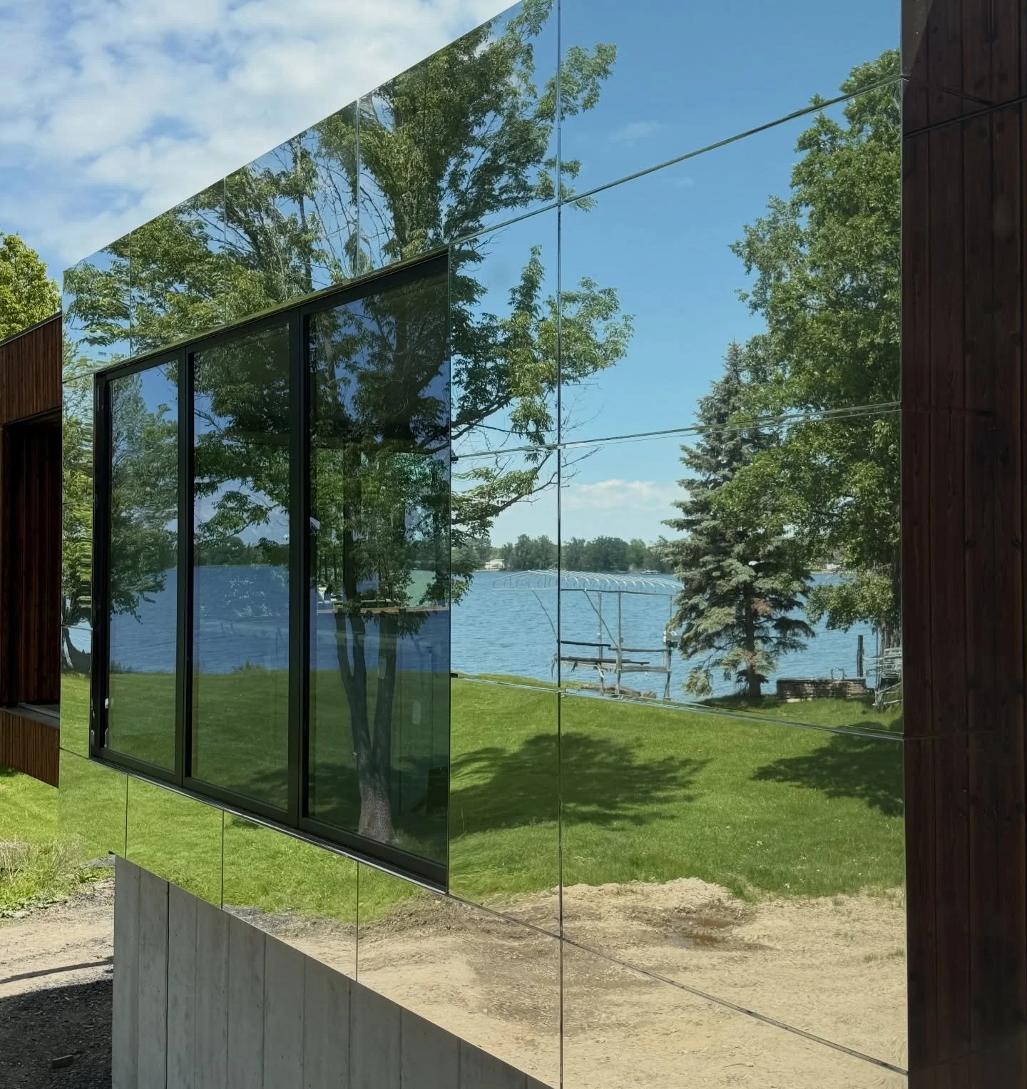 Can you see yourself&hellip;here? 

Unique exterior surfaces and dramatic modern design combine at this home on the lake. We can&rsquo;t wait to see the completed results. 

Architect: @birdseye.building 

#mirrormirror #vermonthomes #houseonalake #f