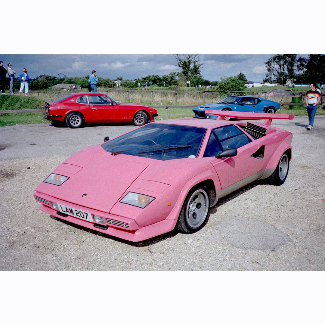 Possibly the most famous British Lamborghini Countach ever? Jeff White's pink over silver 1983 5000 S with blue upholstery: chassis DLA12555. Depicted here at Goodwood in 1988.

Photo credit: SupercarNostalgia.com

#lamborghini #lamborghinicountach #