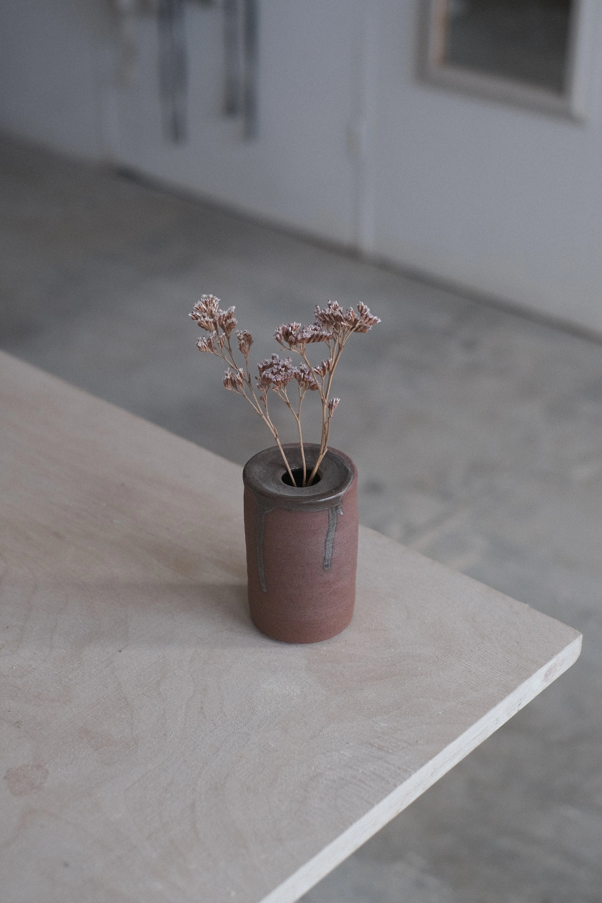 small terracotta bud vase