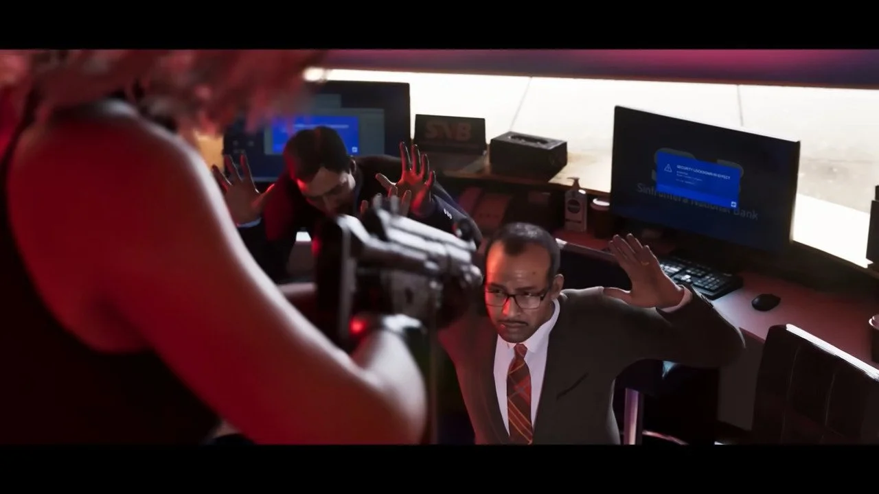 Alt text: A scene from Grand Theft Auto VI; a woman points a gun at two men wearing suits and ties who are sitting with their backs to computer screens.