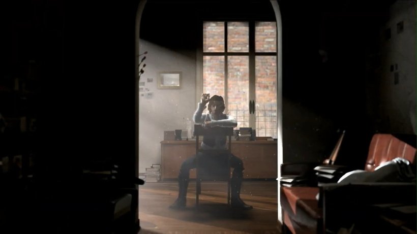 Alt text: In a scene from Folklore, a man sits backwards on a chair while holding a dart.